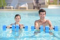 Couple doing exercise in pool Royalty Free Stock Photo