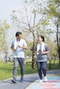 Couple doing exercising by running in the garden. Happy senior couple exercising in the park Royalty Free Stock Photo