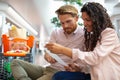 couple doing grocery shopping checking long receipt Royalty Free Stock Photo