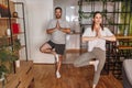 Couple doing yoga as home workout routine Royalty Free Stock Photo