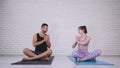 Couple doing yoga in studio Royalty Free Stock Photo