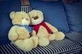 Couple doll bear lover decorated on sofa furniture interior Royalty Free Stock Photo