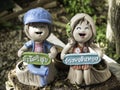 Couple doll pottery with wish well words. Royalty Free Stock Photo