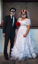 SAN ANTONIO, TEXAS - OCTOBER 28, 2017 - Couple dressed as bride and groom wearing face paint for Dia de Los Muertos/Day of the Dea Royalty Free Stock Photo