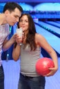 Couple drink cocktail in bowling