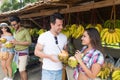 Couple Drink Coconut Cocktail On Street Traditional Fruits Market