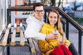 Couple drink coffee in transparent cups.