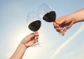 A couple drinking a bottle of red wine outside Royalty Free Stock Photo