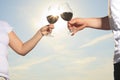 A couple drinking a bottle of red wine outside Royalty Free Stock Photo