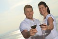 A couple drinking a bottle of red wine outside Royalty Free Stock Photo