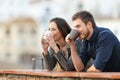 Couple drinking coffee contemplating views Royalty Free Stock Photo