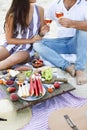 Couple drinking rose wine at picnic on the beach Royalty Free Stock Photo