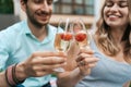 Couple drinking sparkling wine with strawberries Royalty Free Stock Photo