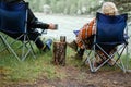 Couple drinking tea in the forest.