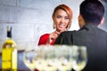 Couple drinking white wine in fancy bar