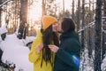 couple drinks tea in a winter forest