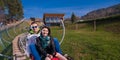 Couple driving on alpine coaster