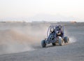 Couple driving Dune Buggy Royalty Free Stock Photo