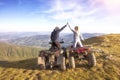 Couple driving off-road with quad bike or ATV Royalty Free Stock Photo