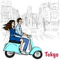 Couple driving scooter