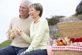 Couple Eating An Al Fresco Meal At The Beach Royalty Free Stock Photo