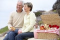 Couple Eating An Al Fresco Meal At The Beach Royalty Free Stock Photo