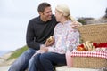 Couple Eating An Al Fresco Meal At The Beach Royalty Free Stock Photo