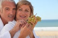 Couple eating a bunch of grapes Royalty Free Stock Photo