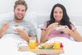 Couple eating cereal during a romantic breakfast