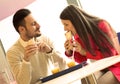 Couple eating in fast food restaurant Royalty Free Stock Photo