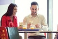 Couple eating in fast food restaurant Royalty Free Stock Photo