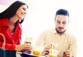 Couple eating in fast food restaurant Royalty Free Stock Photo