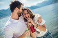 Couple eating fruit on the beach- summer party with friends and healthy food concept Royalty Free Stock Photo