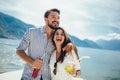 Couple eating fruit on the beach- summer party with friends and healthy food concept Royalty Free Stock Photo