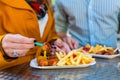 Couple eating German Currywurst