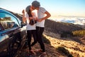 Couple eating having picnic near the car Royalty Free Stock Photo