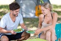 Couple eating salad outdoor