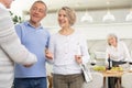 Couple of elderly man and woman greeting friends Royalty Free Stock Photo