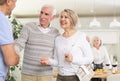 Couple of elderly man and woman greeting friends Royalty Free Stock Photo