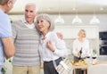 Couple of elderly man and woman greeting friends Royalty Free Stock Photo