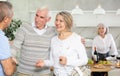 Couple of elderly man and woman greeting friends Royalty Free Stock Photo