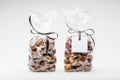 Couple of elegant plastic bags of fresh chestnuts for gift Royalty Free Stock Photo