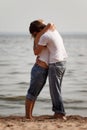 Couple embrace on a beach Royalty Free Stock Photo