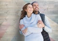 Couple embracing against wooden background Royalty Free Stock Photo