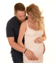 Couple embracing baby bump