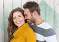 Couple embracing each other against wooden background Royalty Free Stock Photo