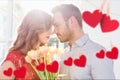 Couple embracing each other with red hanging hearts Royalty Free Stock Photo