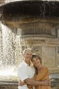 Couple Embracing By Fountain Royalty Free Stock Photo