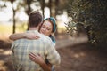 Couple embracing by olive tree at farm Royalty Free Stock Photo