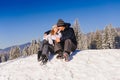 Couple embracing on ski slope Royalty Free Stock Photo